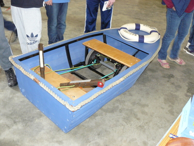 picture of A Boat With Wheels That Can Be Propelled With Oars.